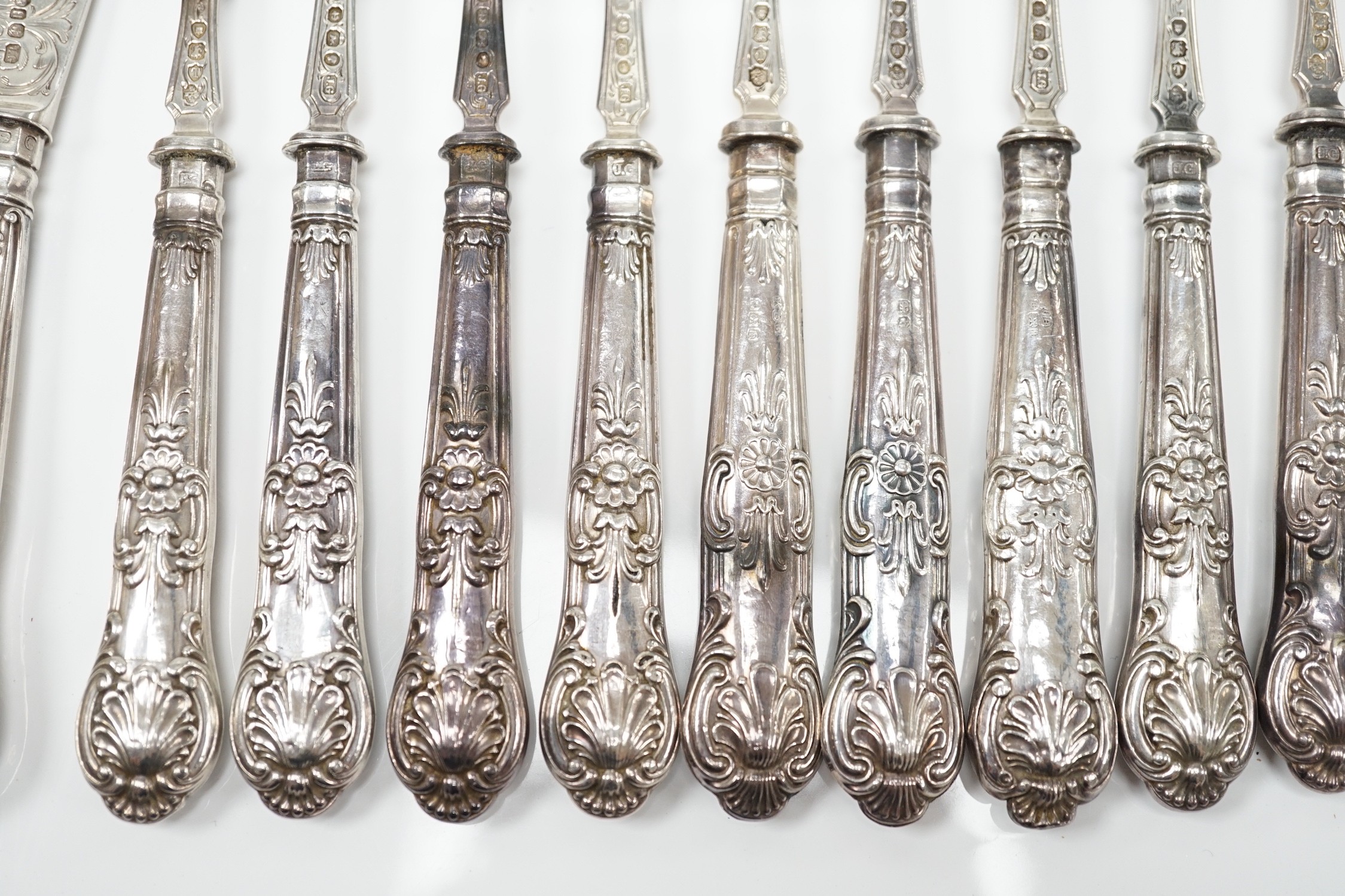 A set of ten pairs of Victorian silver Queen's pattern dessert eaters, maker, JG, Birmingham, 1856/7, loaded handles.